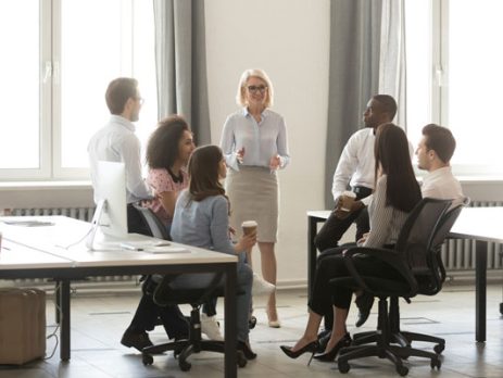 boss in a discussion with employees at the office